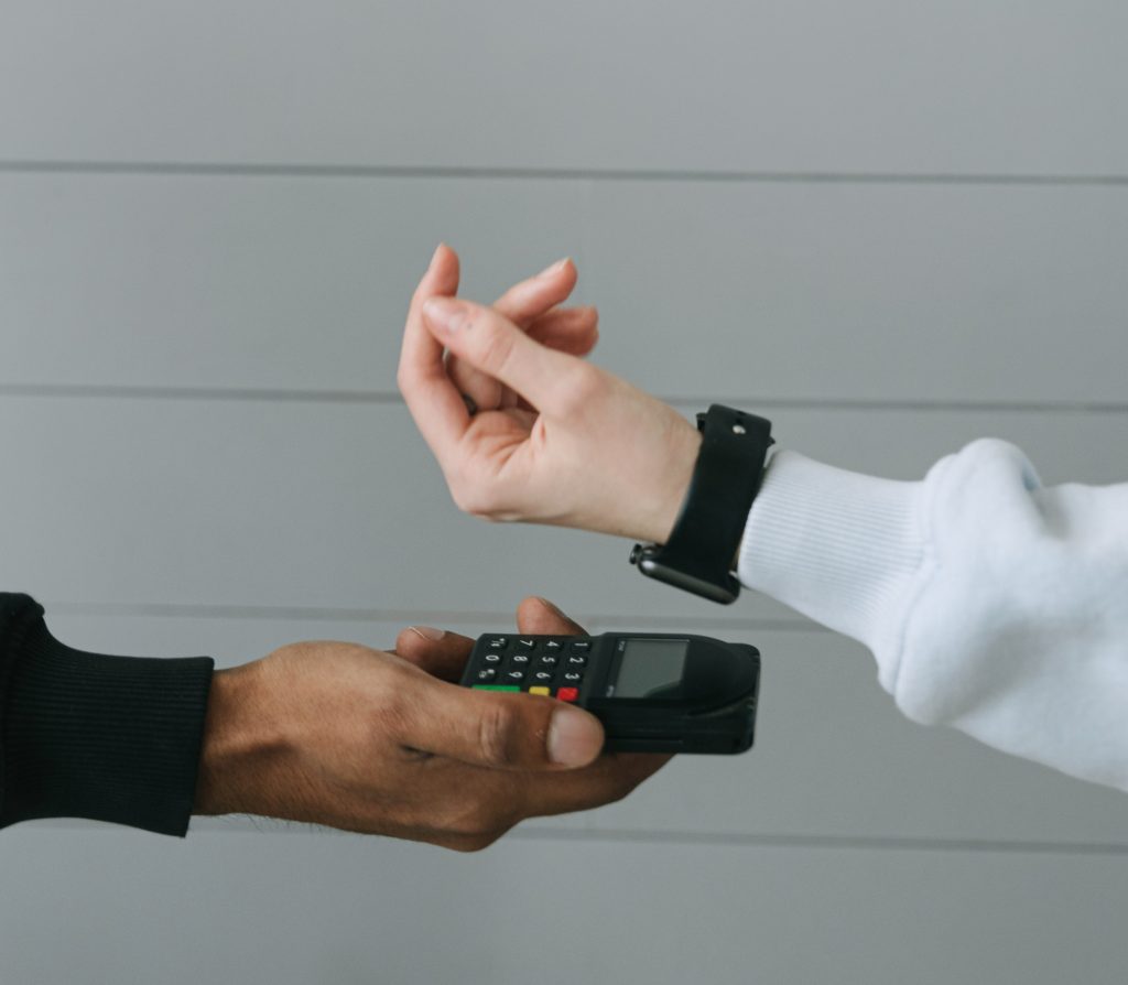 Person in White Long Sleeve Shirt Wearing Smartwatch
