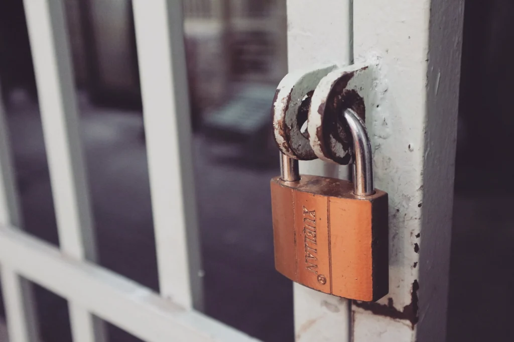 A white gate with a lock to signify a Shopify payment gateway