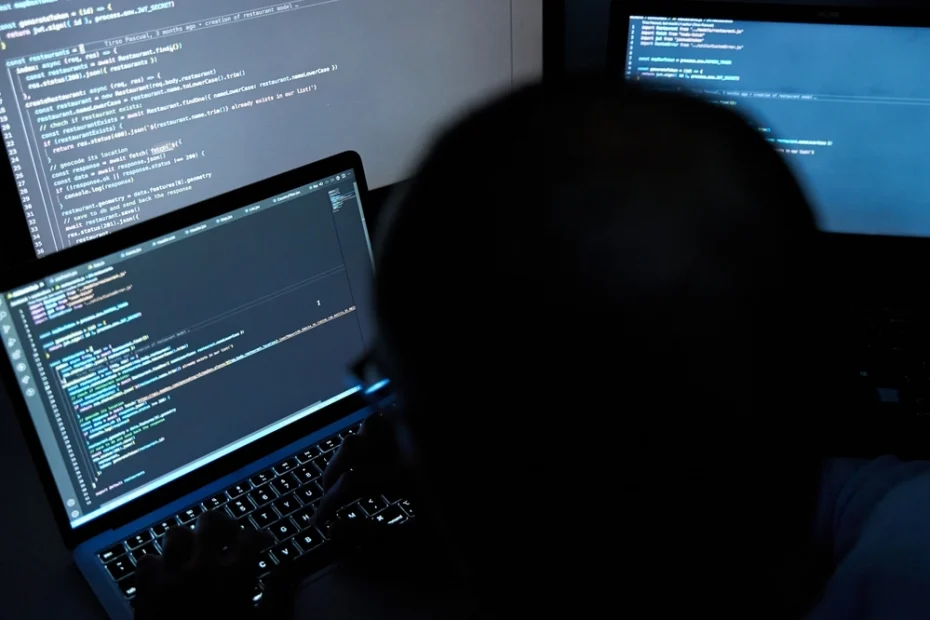 male writing coding on three screens symbolize internet payment gateway