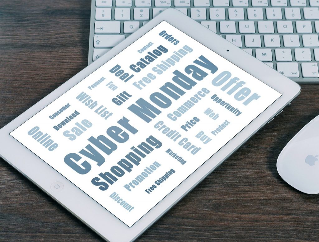 A tablet with words like "Cyber Monday", "Online", "and Sale" on it. 