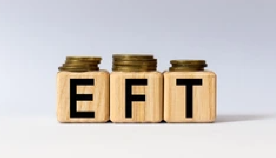 Wooden blocks spelling out EFT with a stack of coins on top of each block.