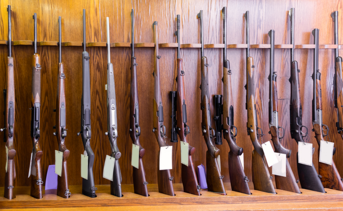 Guns stacked against a wall
